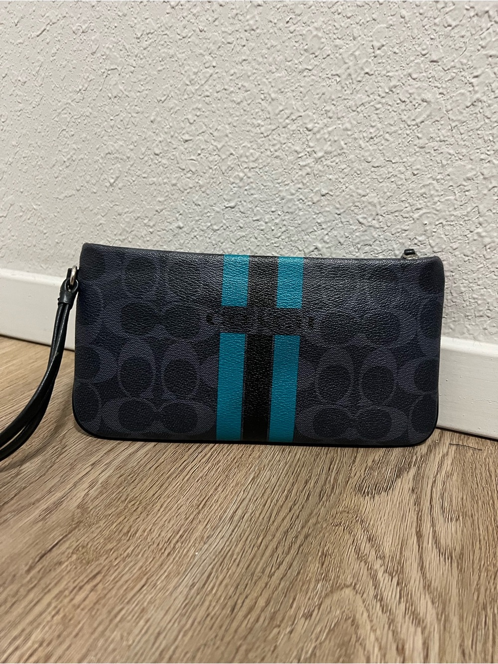 Coach Dark Gray Signature Mini Wristlet with Teal and Black Stripes.
